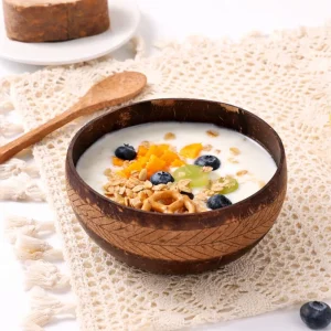 Engraved Coconut Shell Bowl with Palm Leaf Pattern – Handmade Natural Tableware 7 engraved coconut shell bowl with granola on a natural table setting