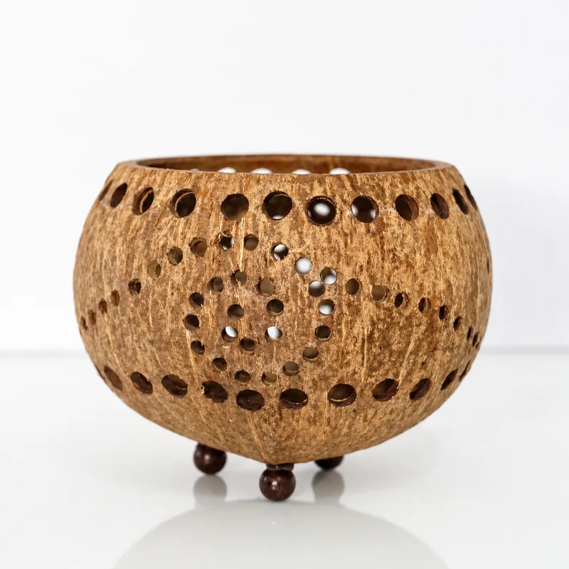 perforated coconut shell tealight candle holder spiral pattern detail perforated coconut shell tealight candle holder spiral pattern detail