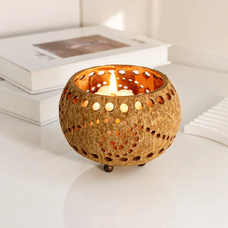 perforated coconut shell tealight candle holder spiral pattern lit perforated coconut shell tealight candle holder spiral pattern lit