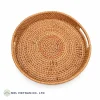 Round rattan tray with natural woven texture, product view 1