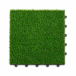 Artificial grass tile with round interlocking connectors on white background