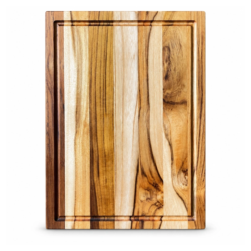 Teak Grooved Cutting Board 30 x 20 cm on a clean white background Teak Grooved Cutting Board 30 x 20 cm on a clean white background