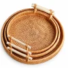 Wicker basket round tray collection with bamboo handles on white