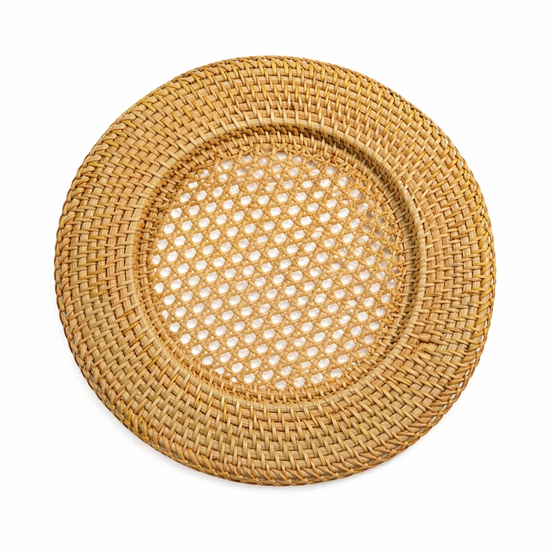 Handwoven rattan charger plate with an open lattice centre and broad woven rim Handwoven rattan charger plate with an open lattice centre and broad woven rim