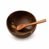 Natural coconut shell bowl with a coconut wood spoon on a white background