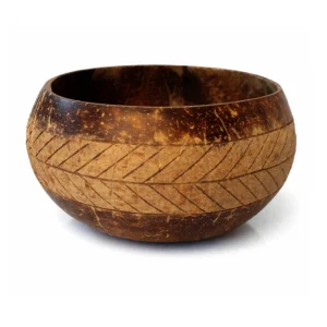 Smooth interior and hand-engraved palm leaf band on a coconut shell bowl