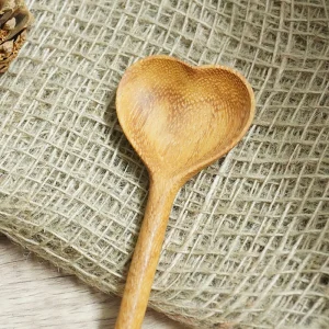 Close view of the carved heart bowl and wood grain