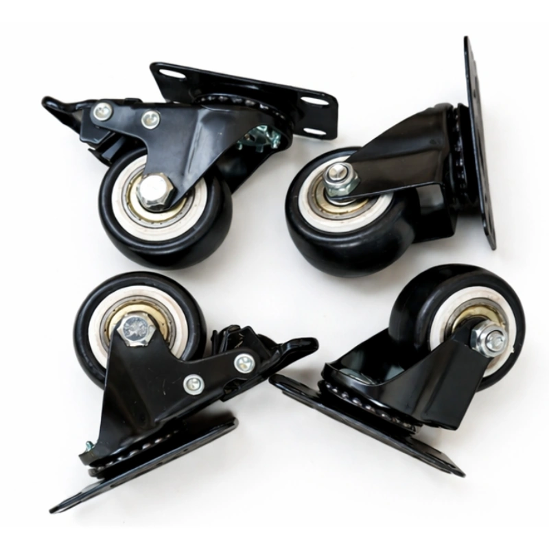 Four black swivel caster assemblies with locking brake levers Four black swivel caster assemblies with locking brake levers