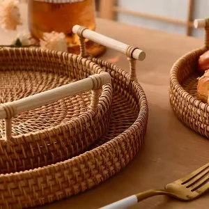 Wicker Basket, Round Dinner Plate with Handle 3 Close view of wrapped bamboo handles and handwoven rattan tray rims