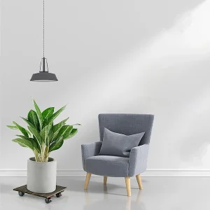 Square acacia plant caddy supporting a potted plant beside an armchair