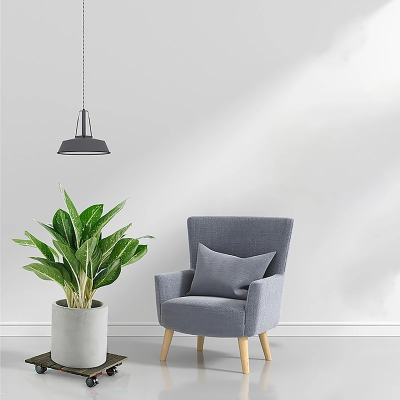 Square Dark Walnut Acacia Plant Caddy with Locking Wheels – 30cm 5 Square acacia plant caddy supporting a potted plant beside an armchair