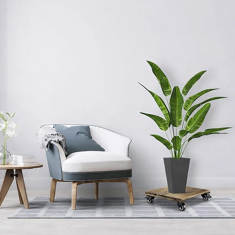 Square Acacia Plant Caddy with Locking Casters – Dark Walnut, 30cm 5 Square acacia plant caddy supporting a planter beside an armchair