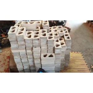 Whale Wooden Desk Holder – Doussie Wood 2 Stacked wooden blocks with recessed openings at factory