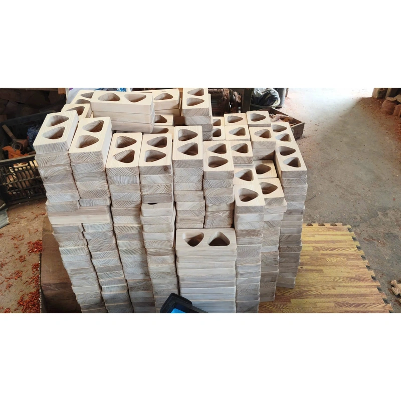 Stacked wooden blocks with recessed openings at factory Stacked wooden blocks with recessed openings at factory