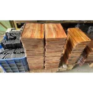 Wrapped wooden trays stacked in batches in the storage area