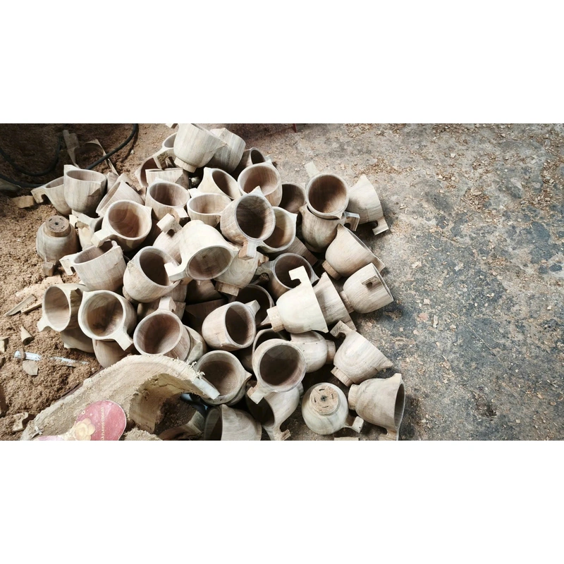 Wooden cup blanks on a workshop floor Wooden cup blanks on a workshop floor