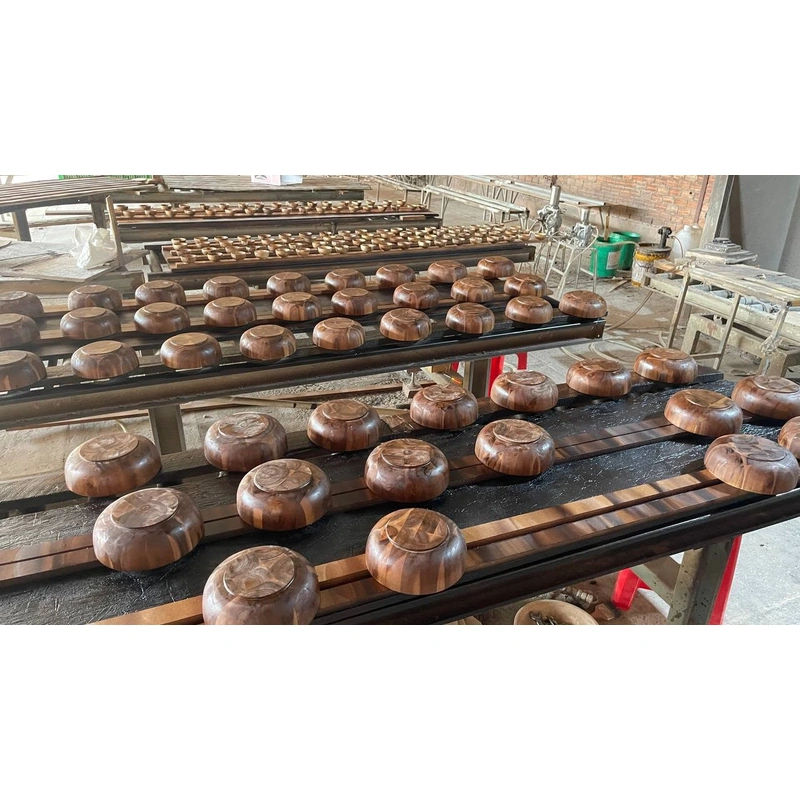 Wooden bowls on racks during the production process Wooden bowls on racks during the production process