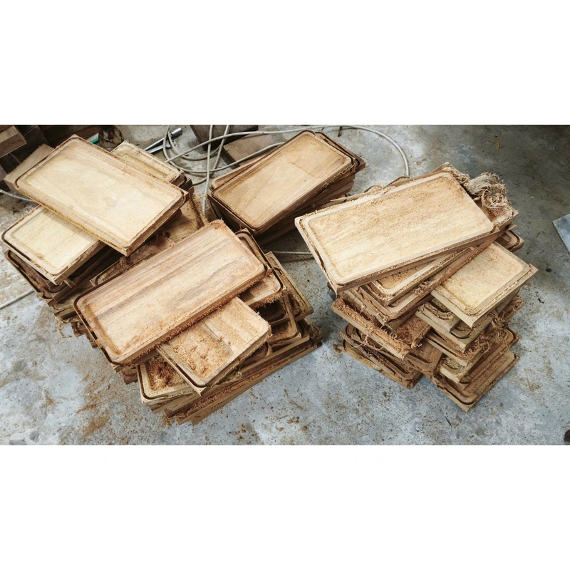 Stacks of rectangular wooden trays after machining Stacks of rectangular wooden trays after machining