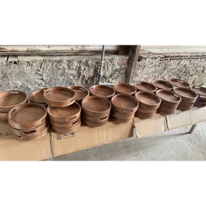 Other wooden tray designs stacked at the factory