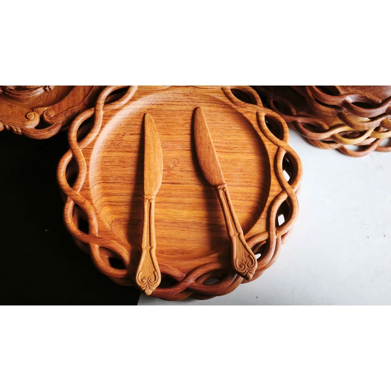 Carved round wooden tray with wooden utensils from the factory collection Carved round wooden tray with wooden utensils from the factory collection