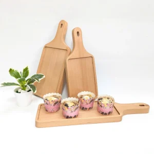 Tabletop styling with wooden trays and serving pieces from the wider range