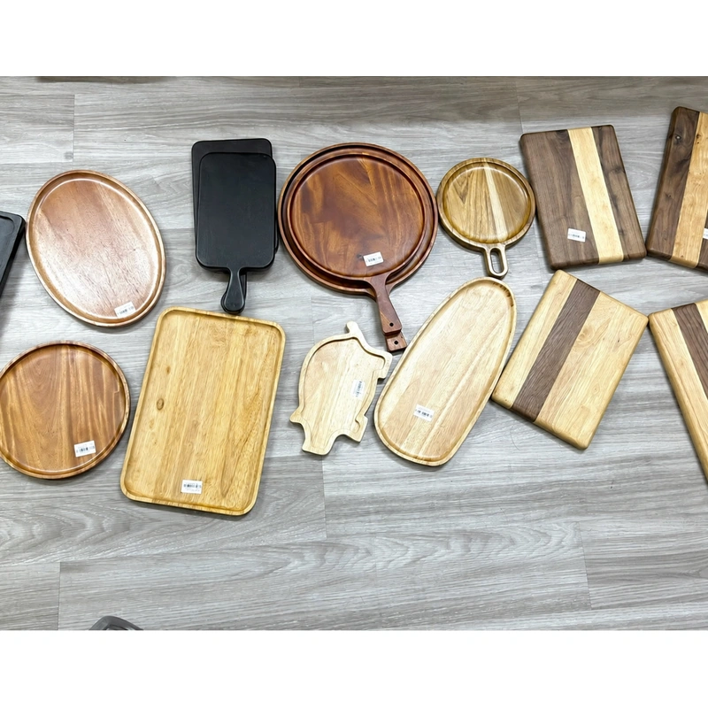 A selection of wooden trays and serving pieces from the wider range A selection of wooden trays and serving pieces from the wider range