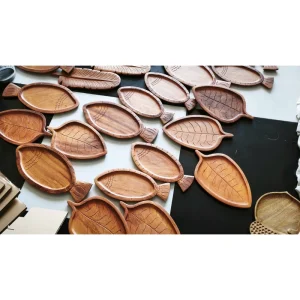 Arched Grooved Doussie Wood Tray 5 Wood grain and carved details across assorted serving trays