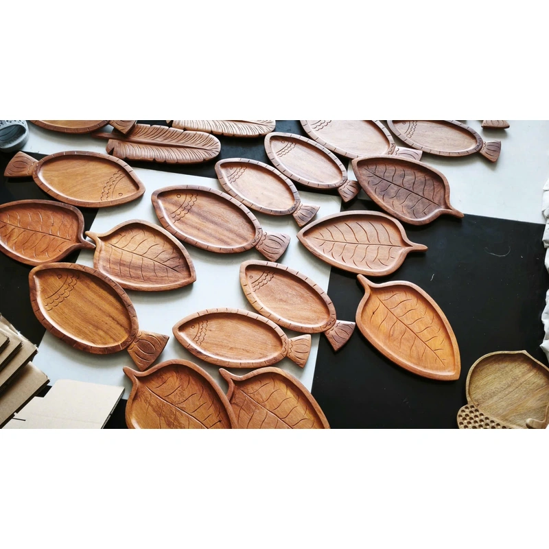 Wood grain and carved details across assorted serving trays Wood grain and carved details across assorted serving trays