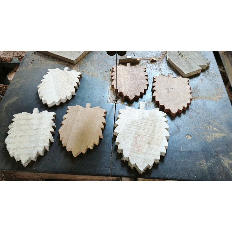 Leaf-shaped wooden blanks on a workshop bench Leaf-shaped wooden blanks on a workshop bench