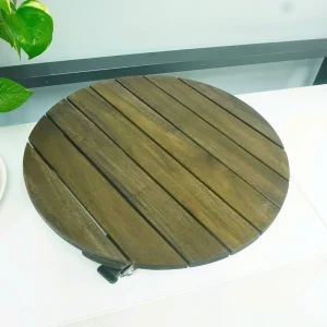 Top view of the round acacia plant dolly showing the wood grain and slatted platform
