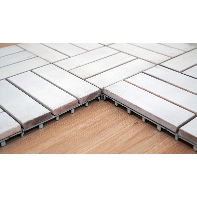 Joined white decking modules showing wood edges and the raised PP base Joined white decking modules showing wood edges and the raised PP base