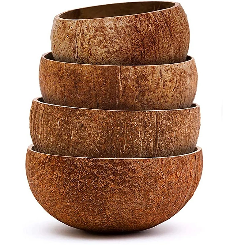 Stacked natural coconut bowls showing individual grain and shape variations Stacked natural coconut bowls showing individual grain and shape variations