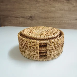 Woven holder containing stacked round coasters for compact storage