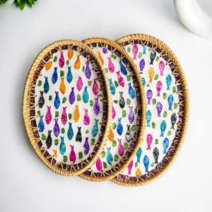 Three oval rattan trays showing the rainbow fish pattern and different sizes