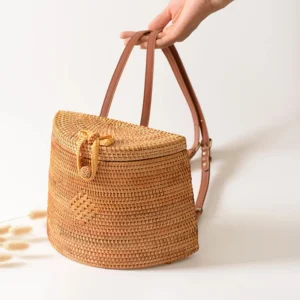 Reference brown-motif version of the woven backpack with adjustable straps