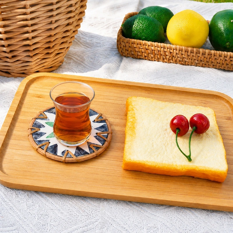 Wholesale Rattan Mother of Pearl Inlay Coasters 6 A glass of tea on a flower-pattern shell inlay coaster on a wooden tray