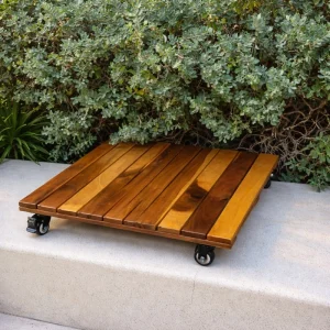 Wooden plant caddy positioned beneath garden foliage