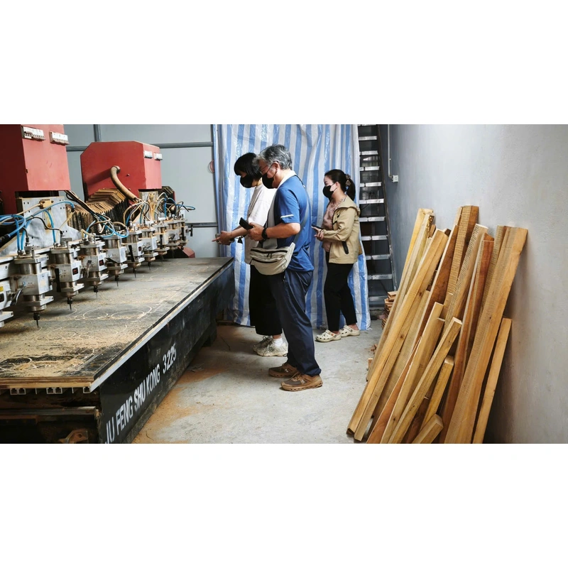 CNC machinery and wooden boards at the factory