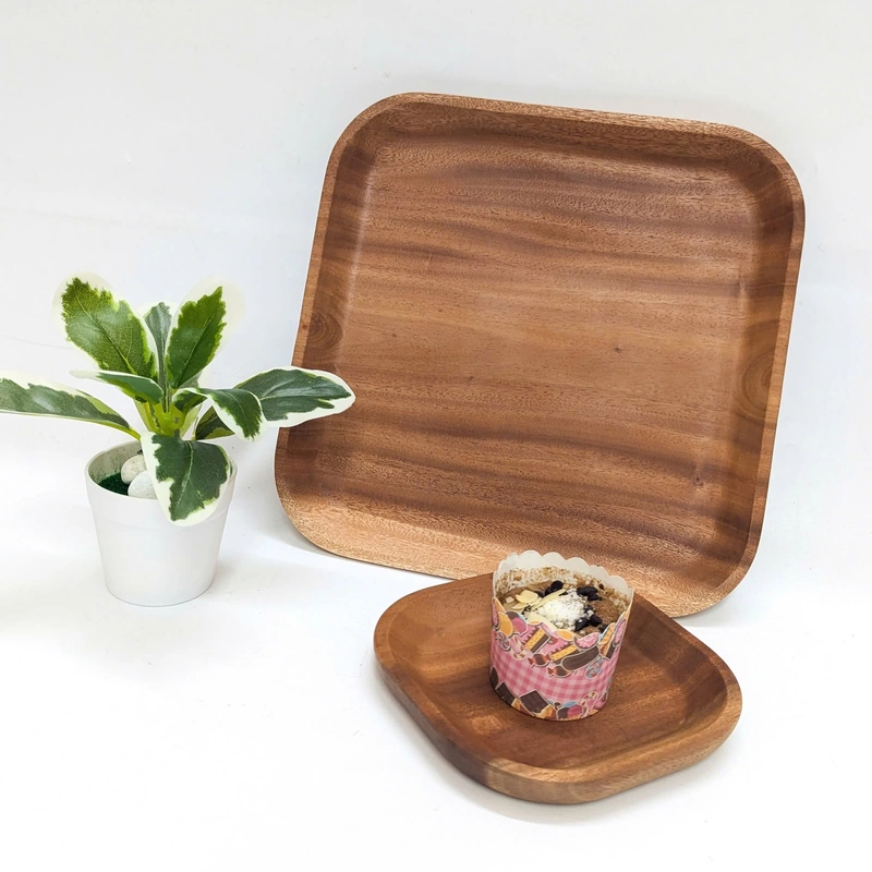 Square wooden trays shown with a tabletop setting from the wider range