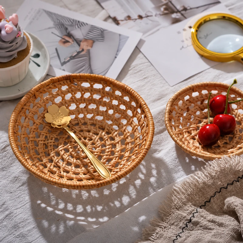 Handwoven Round Rattan Serving Basket | 3 Sizes 2 Round rattan serving basket with cherries in a tabletop display