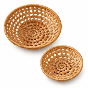 Two round rattan serving baskets on a white background