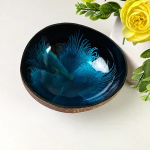 The blue feather-effect bowl styled with flowers; flowers are presentation props.