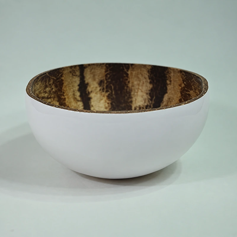 White Exterior Lacquer Coconut Bowl 3 A side view of the white-coated outside and natural brown inside.