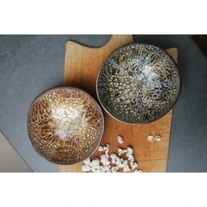 Black gold eggshell bowl beside a separate bronze colour reference