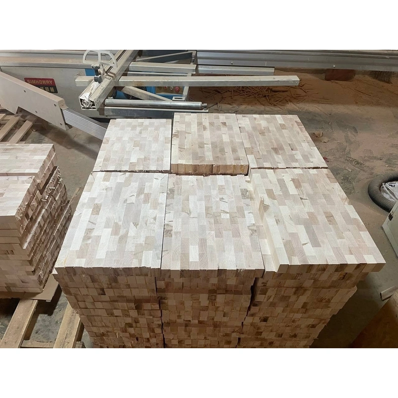 African Mahogany Octagonal Grooved Tray 25 cm 6 Wooden board blanks beside machinery during the production process