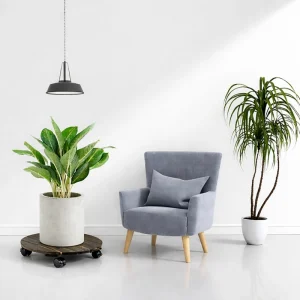 Dark walnut acacia plant caddy supporting a planter beside a lounge chair