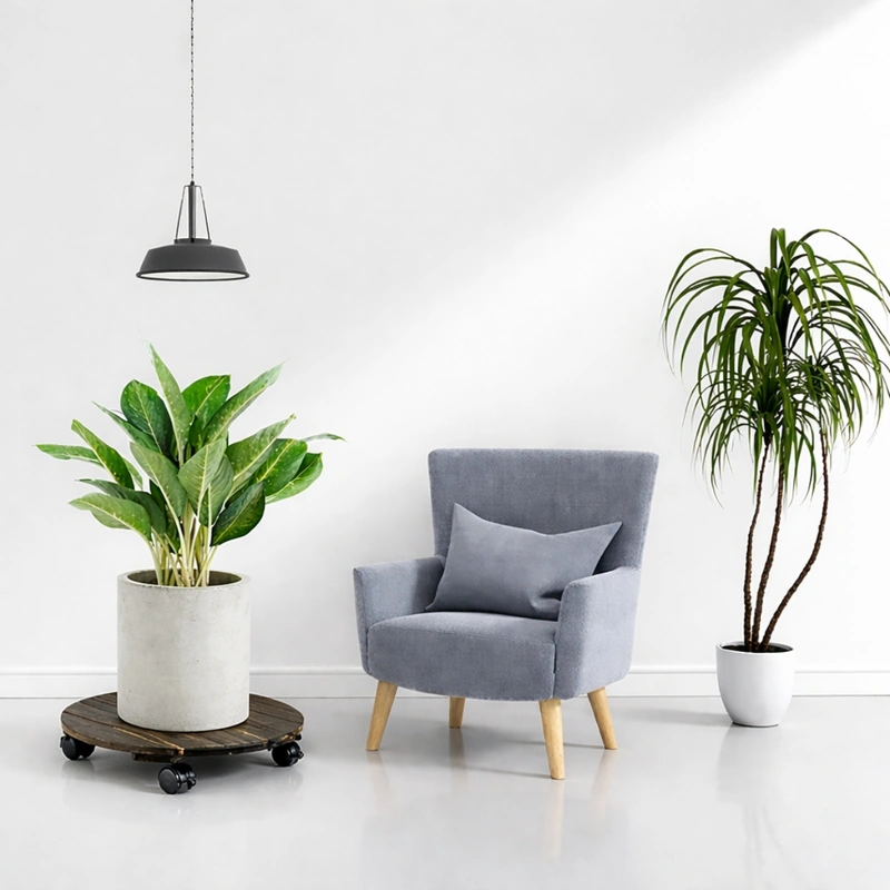Round Dark Walnut Acacia Plant Caddy with Locking Wheels – 35cm 5 Dark walnut acacia plant caddy supporting a planter beside a lounge chair