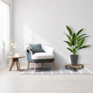 Square dark acacia plant caddy with a tall planter beside a lounge chair