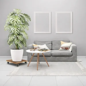 Square golden wooden plant stand with a large white planter beside a grey sofa