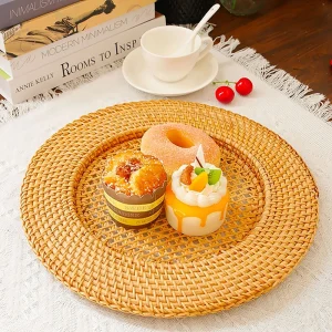 Handwoven Rattan Charger Plate 1 Handwoven rattan charger plate styled with pastries and a tea cup